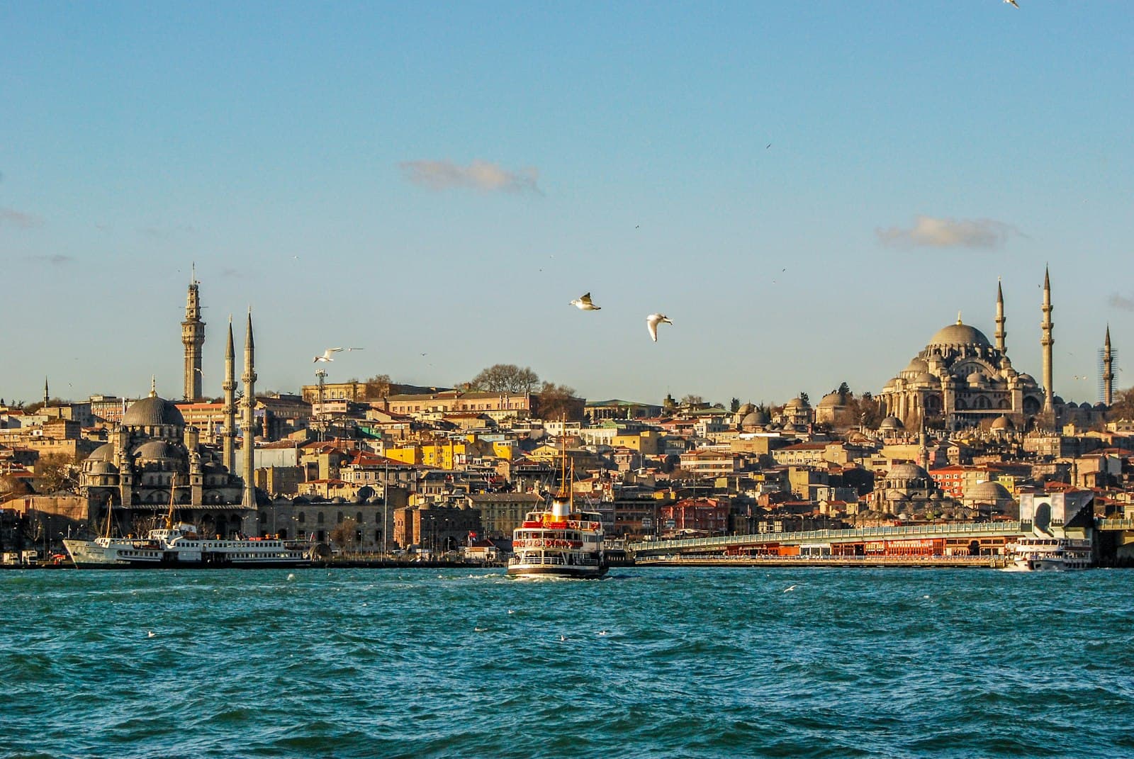 Ferry crossing the Bosphorus with mosques on the Istanbul skyline