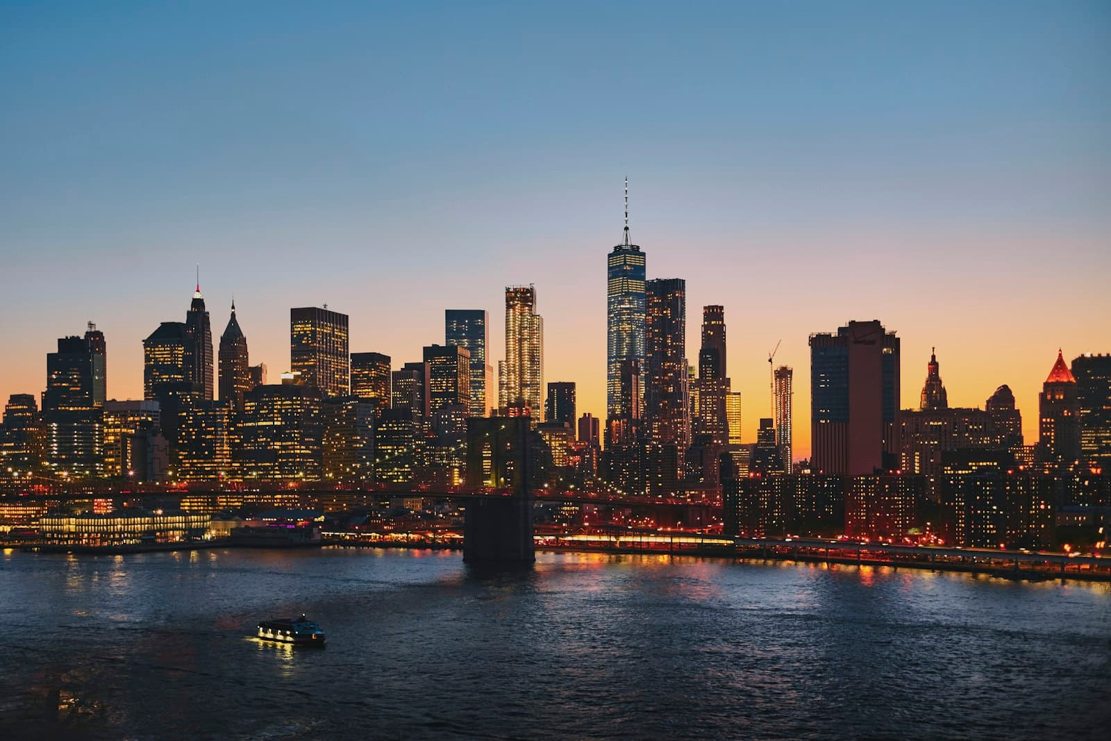 Manhattan skyline at dusk seen across the East River